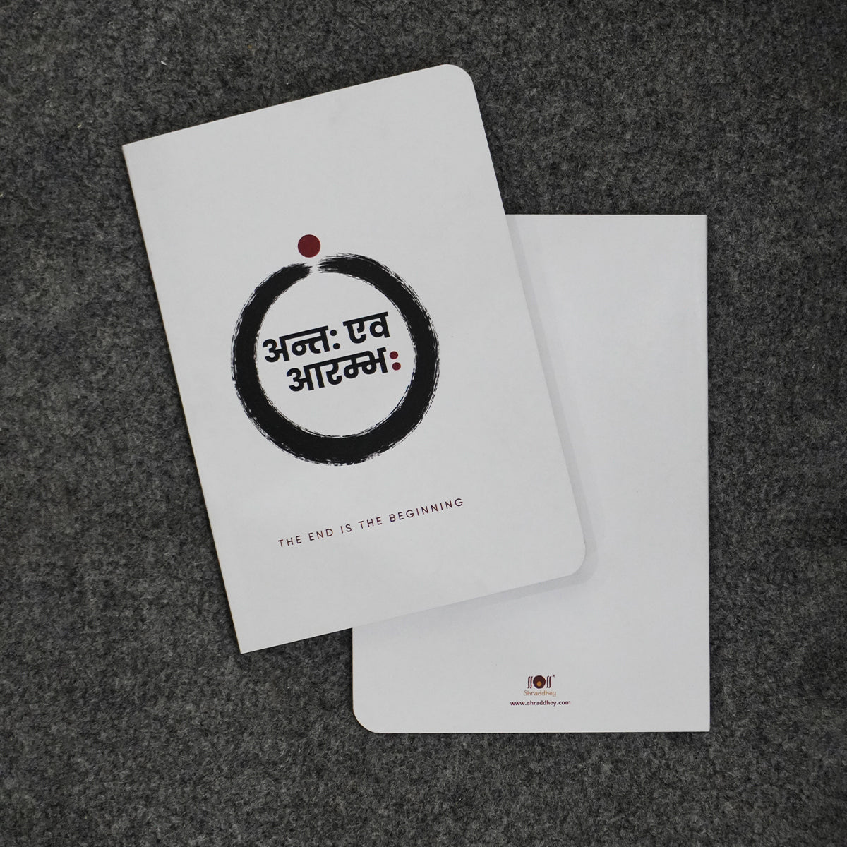 Prishthika Beginning notebook, white cover with an ink circle, front and back